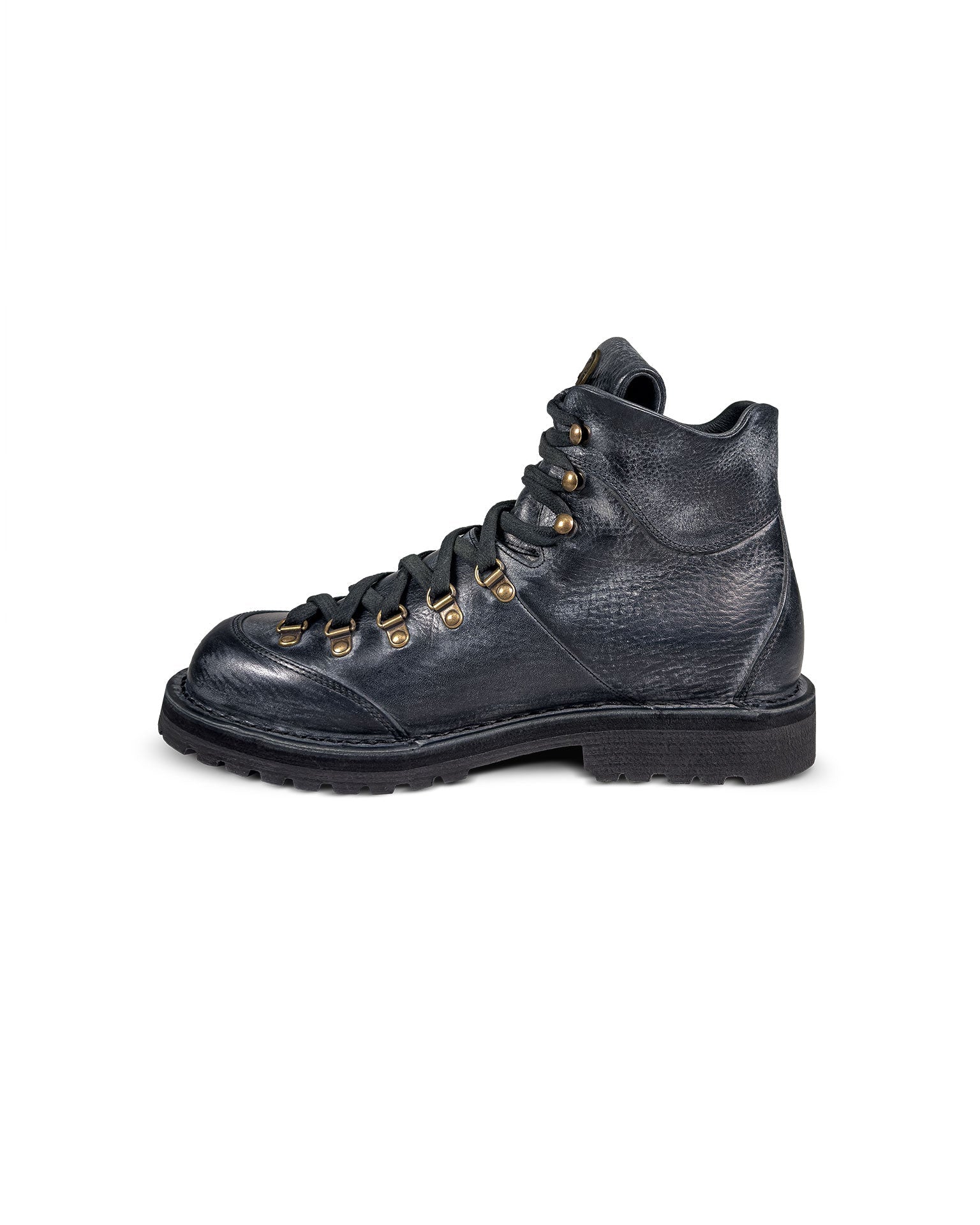 Close-up side 2 view of the Untitled Artworks x Fracap Destroyer Boot in black, showcasing its spray-effect finish, oversized fold-over tongue, and antique brass eyelets.