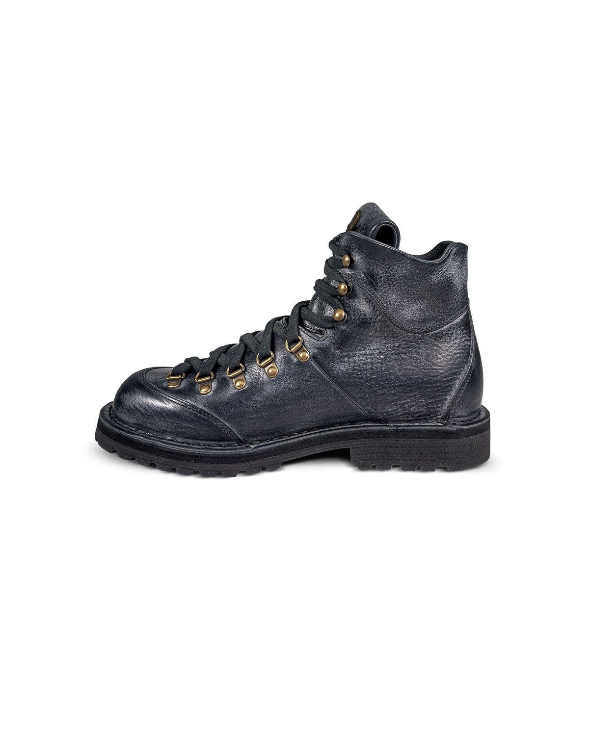 Close-up side 2 view of the Untitled Artworks x Fracap Destroyer Boot in black, showcasing its spray-effect finish, oversized fold-over tongue, and antique brass eyelets.
