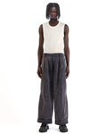 Front view of the blue corduroy pants showing the wide-leg cut and pleated front